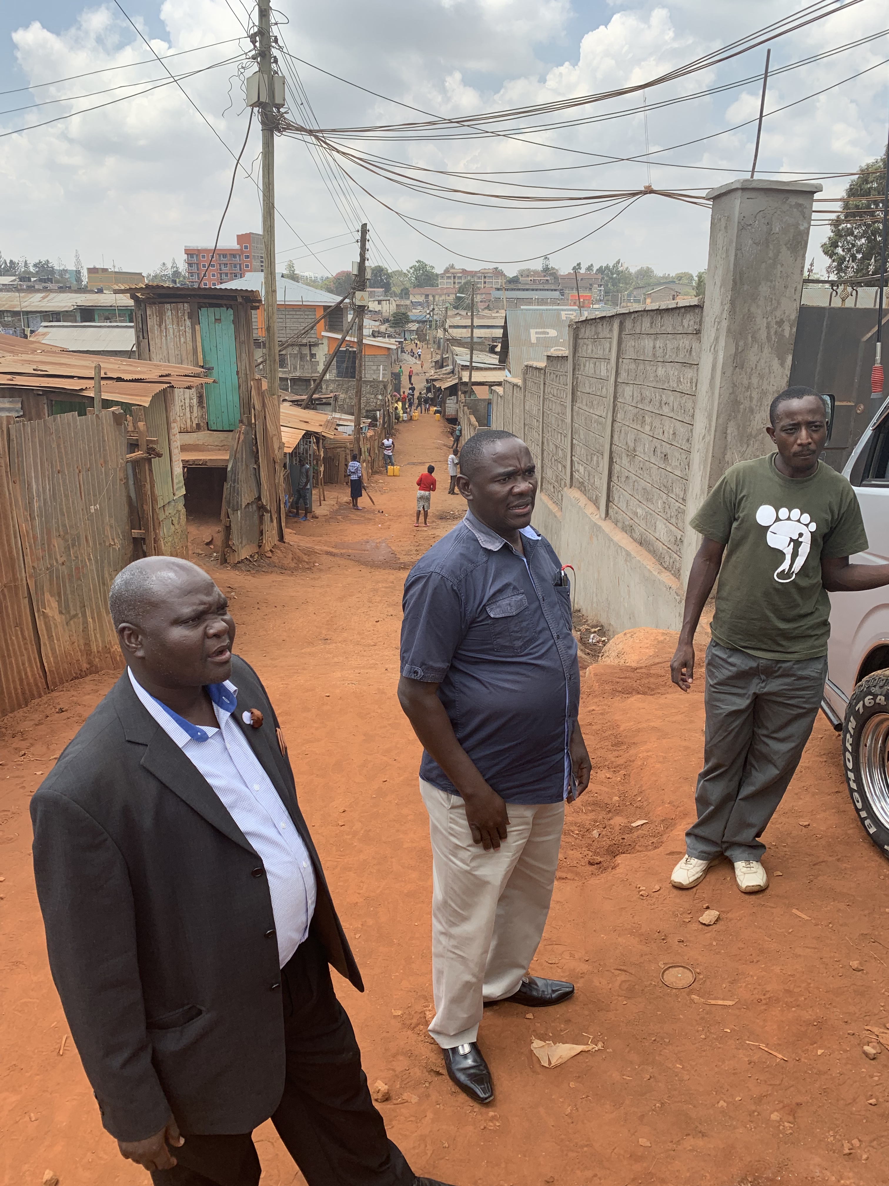 Pastor Joseph (center) welcomes us